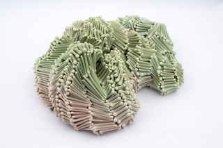 Untitled 2025, dyed nylon fabric, handshaped porcelain elements, tied
46 x 38 x 13 cm, Photo Thor Brødreskift